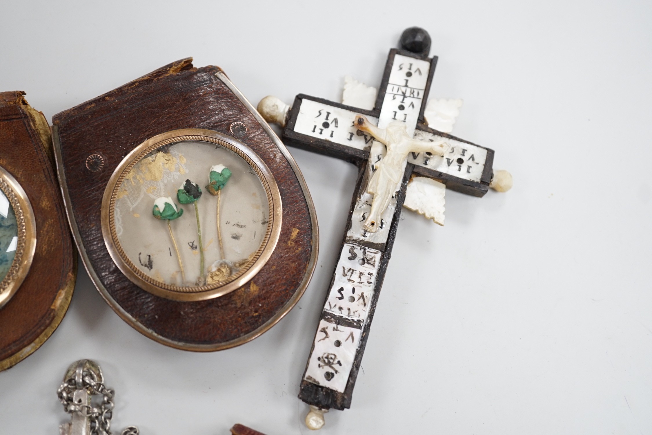 A group of catholic related collectables including Corpus Christi, rosary bead holders etc.